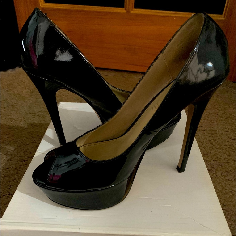 Black Aldo peep toed high heels